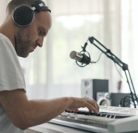 Professional musician playing and composing music at home